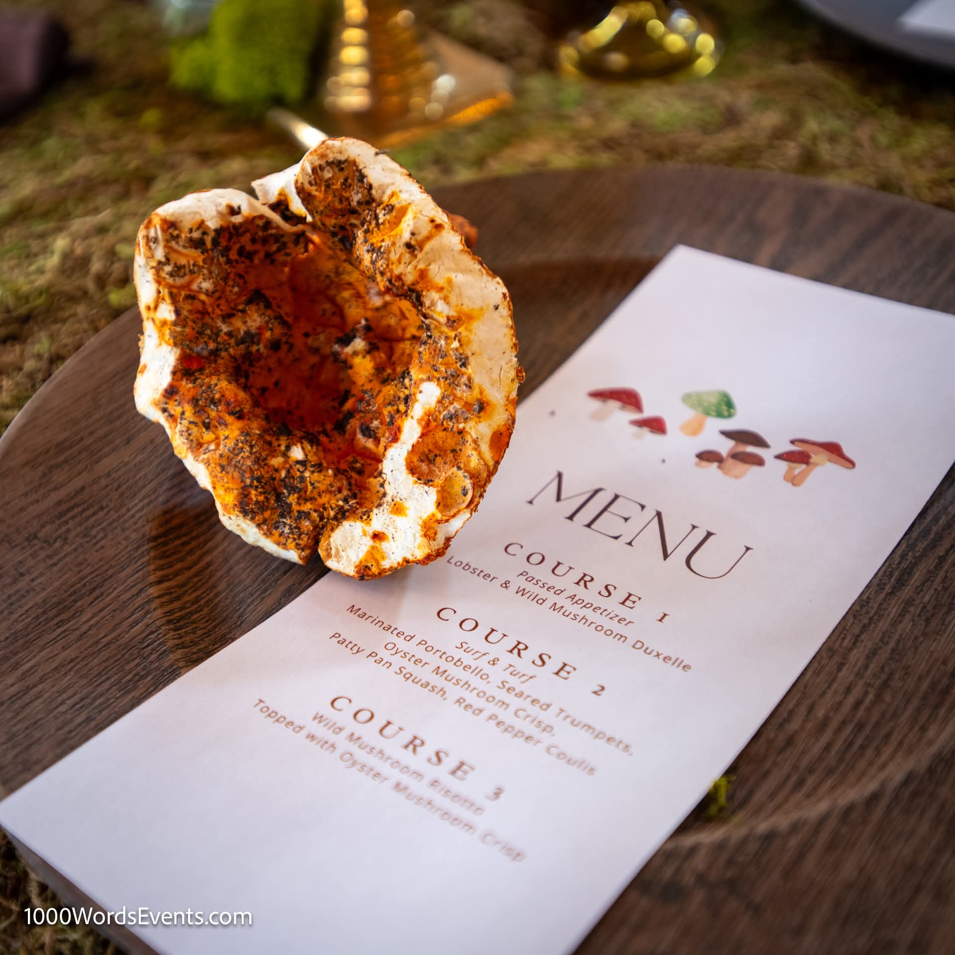 Closeup of mushroom inspired three course farm to table dinner menu laid on a wood charger with a giant lobster mushroom