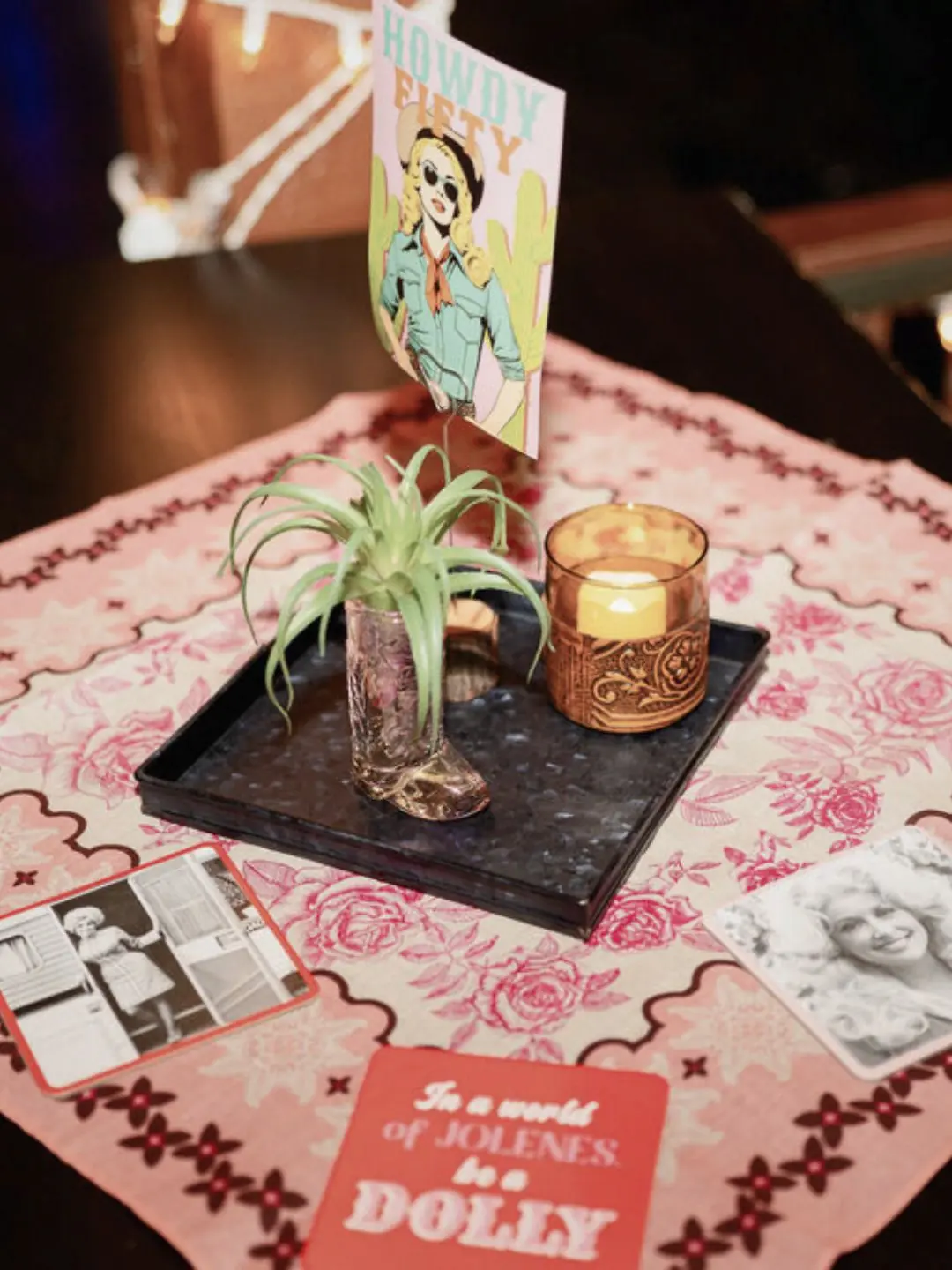 Close-up of a retro Howdy party menu card on a wooden table